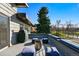 Stylish outdoor terrace with seating and grill, perfect for entertaining and enjoying natural surroundings at 5390 Rosemary Ln, Denver, CO 80221