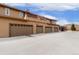 Exterior shot of multiple garages offering ample parking and storage space for vehicles and equipment at 8627 Gold Peak Pl # C, Highlands Ranch, CO 80130