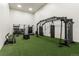 Functional gym equipped with punching bags, climbing ropes and weights at 8627 Gold Peak Pl # C, Highlands Ranch, CO 80130