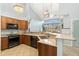 Open kitchen boasts granite countertops, stainless steel appliances, a corner sink, and a breakfast bar at 8627 Gold Peak Pl # C, Highlands Ranch, CO 80130