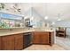 Spacious kitchen with granite countertops, stainless steel appliances, and a cozy breakfast bar at 8627 Gold Peak Pl # C, Highlands Ranch, CO 80130