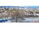 Beautiful mountain view overlooking a snow-covered landscape and community with distant trees at 8627 Gold Peak Pl # C, Highlands Ranch, CO 80130