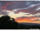 Beautiful sunset view with vibrant orange and purple hues in the sky at 8627 Gold Peak Pl # C, Highlands Ranch, CO 80130