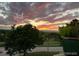 Scenic sunset view overlooking the neighborhood and golf course at 8627 Gold Peak Pl # C, Highlands Ranch, CO 80130