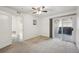 Bright bedroom with plush carpeting and sliding door access to balcony at 1629 S Deframe St # A1, Lakewood, CO 80228