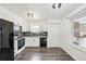 Modern kitchen with black appliances, sleek countertops, and ample natural light at 1629 S Deframe St # A1, Lakewood, CO 80228