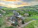 Elevated angle of this stunning home and neighborhood with lush landscaping and mountain views at 12947 Lazy Dog Ln, Littleton, CO 80127