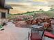 Exterior backyard showcasing seating area, with views of the hills behind at 12947 Lazy Dog Ln, Littleton, CO 80127