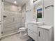 Bright bathroom with a glass-enclosed shower, modern vanity, and a sleek, contemporary design at 12947 Lazy Dog Ln, Littleton, CO 80127