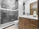 Elegant bathroom featuring a glass enclosed shower, tile floors and a large mirror at 12947 Lazy Dog Ln, Littleton, CO 80127