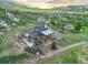 Aerial view showcasing this stunning multi-level home with mountain views at 12947 Lazy Dog Ln, Littleton, CO 80127