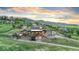 Stunning two-story home nestled in a hillside setting with mountain views and attached two car garage at 12947 Lazy Dog Ln, Littleton, CO 80127