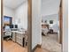 Hallway view showing a bedroom and office space at 12947 Lazy Dog Ln, Littleton, CO 80127