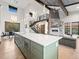 Contemporary kitchen with a large island, stainless appliances, and open floor plan at 12947 Lazy Dog Ln, Littleton, CO 80127