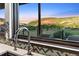 Modern kitchen sink with a stunning view of the surrounding landscape and mountains at 12947 Lazy Dog Ln, Littleton, CO 80127