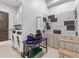 Spacious pet grooming area including a washing station, laundry, and grooming table at 12947 Lazy Dog Ln, Littleton, CO 80127