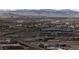 Expansive aerial view of the city featuring Empower Field at Mile High with highways and mountains in the background at 1133 14Th St # 3430, Denver, CO 80202