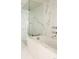 Spa-like bathroom with glass shower, soaking tub, and luxurious marble finishes at 1133 14Th St # 3430, Denver, CO 80202