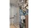 Stylish bathroom boasts a glass-enclosed shower with unique tile and artistic wallpaper at 1133 14Th St # 3430, Denver, CO 80202