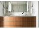 Luxury bathroom featuring double vanity, marble countertops, and modern lighting fixtures at 1133 14Th St # 3430, Denver, CO 80202