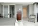 Modern bedroom with ensuite bathroom, stylish chair, and neutral color palette at 1133 14Th St # 3430, Denver, CO 80202