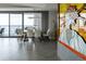 Dining room featuring a unique art piece, modern chandelier, and city views at 1133 14Th St # 3430, Denver, CO 80202