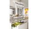 Close-up of kitchen island featuring granite countertops and modern chandelier at 1133 14Th St # 3430, Denver, CO 80202