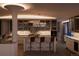 Bright, modern kitchen with marble counters, crystal chandelier, and counter seating at 1133 14Th St # 3430, Denver, CO 80202