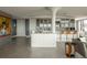 Modern kitchen featuring white cabinets, granite countertops, and breakfast bar at 1133 14Th St # 3430, Denver, CO 80202