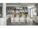 Bright, modern kitchen with marble counters, crystal chandelier, and seating at 1133 14Th St # 3430, Denver, CO 80202
