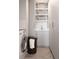 Bright laundry room offers a sink, built in storage, modern washer, and stylish herringbone floors at 1133 14Th St # 3430, Denver, CO 80202