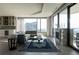 Bright, spacious living room with modern decor, fireplace, and city views at 1133 14Th St # 3430, Denver, CO 80202
