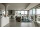 Spacious living room with a fireplace, floor to ceiling windows, city views, and modern decor at 1133 14Th St # 3430, Denver, CO 80202