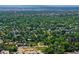 Expansive aerial shot showcasing the neighborhood's lush greenery and city views at 2680 S Garfield Cir, Denver, CO 80210