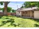 Large backyard with a covered patio, perfect for outdoor entertaining and relaxation at 2680 S Garfield Cir, Denver, CO 80210