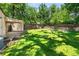 Expansive backyard featuring lush green grass and a cozy fire pit area for outdoor gatherings at 2680 S Garfield Cir, Denver, CO 80210