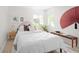 Bright bedroom featuring large windows and stylish decor, creating a cozy and inviting space at 2680 S Garfield Cir, Denver, CO 80210