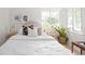 Bright bedroom with a plush bed, decorative pillows, and natural light at 2680 S Garfield Cir, Denver, CO 80210