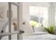Bright bedroom featuring a door, ample natural light, and plant at 2680 S Garfield Cir, Denver, CO 80210