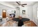 Cozy dining area with a modern round table and stylish chairs, open to the living room at 2680 S Garfield Cir, Denver, CO 80210