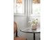 Bright dining nook with marble table, flowers and view to the outdoors at 2680 S Garfield Cir, Denver, CO 80210
