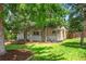 Charming home with mature trees and a well-manicured lawn at 2680 S Garfield Cir, Denver, CO 80210