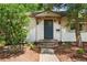 Inviting front entrance with a brick pathway leading to a blue front door at 2680 S Garfield Cir, Denver, CO 80210