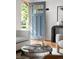 Stylish blue front door with glass and door hardware opening up to a welcoming entrance area at 2680 S Garfield Cir, Denver, CO 80210
