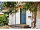 Charming home featuring a stylish blue front door with decorative glass and brick steps at 2680 S Garfield Cir, Denver, CO 80210