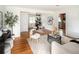 Spacious living room with hardwood floors, decorative accents, and great natural light at 2680 S Garfield Cir, Denver, CO 80210
