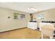 Community laundry room with multiple washers and dryers for resident convenience at 7755 E Quincy Ave # 206, Denver, CO 80237