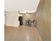 Bright living room with wood floors, fan and slider to balcony at 7755 E Quincy Ave # 206, Denver, CO 80237