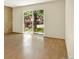 Bright living room featuring wood floors and a large window at 7755 E Quincy Ave # 206, Denver, CO 80237