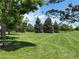 Expansive green park with mature trees and manicured lawn, ideal for outdoor activities at 7755 E Quincy Ave # 206, Denver, CO 80237